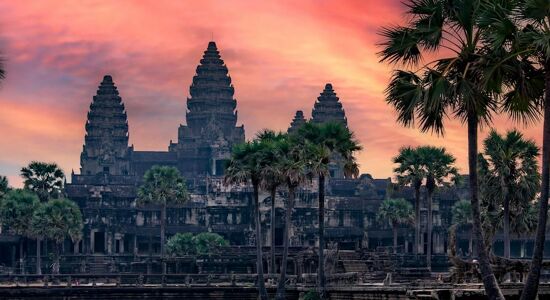 Iconic Angkor Wat towers in Cambodia for a vibrant Angkor Wat Tours banner with Legend Travel Group.